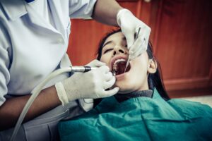Dentists treat patients' teeth in ventura
